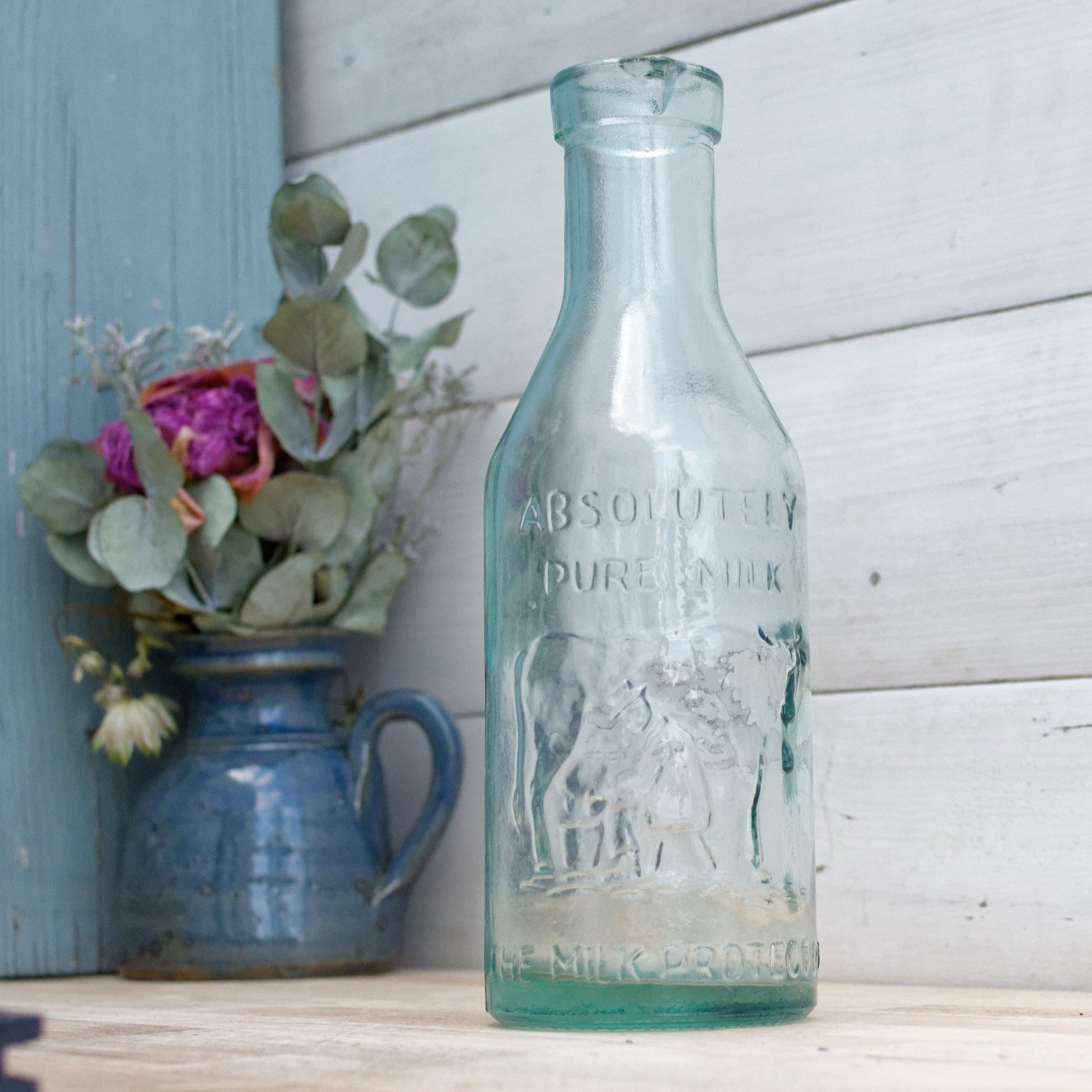 Vintage "ABSOLUTELY PURE Milk" Bottle  "The Milk Protector" Glass Milk Carafe 
Aqua Glassware Farmhouse Cow Scene