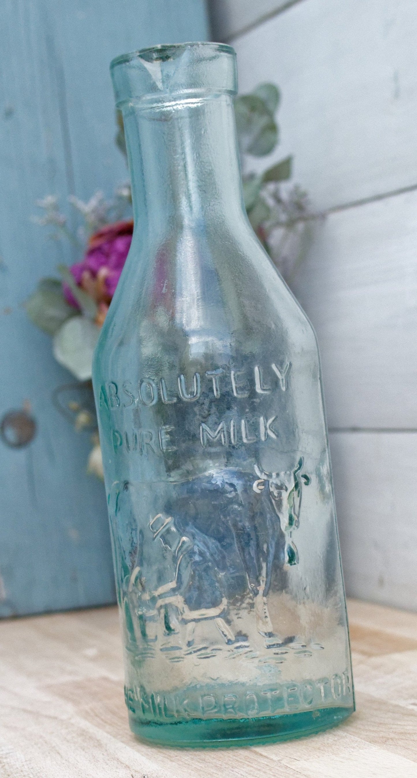 Vintage "ABSOLUTELY PURE Milk" Bottle  "The Milk Protector" Glass Milk Carafe 
Aqua Glassware Farmhouse Cow Scene