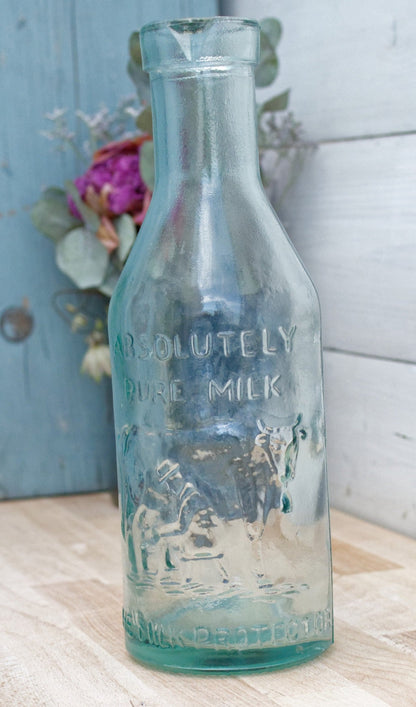 Vintage "ABSOLUTELY PURE Milk" Bottle  "The Milk Protector" Glass Milk Carafe 
Aqua Glassware Farmhouse Cow Scene