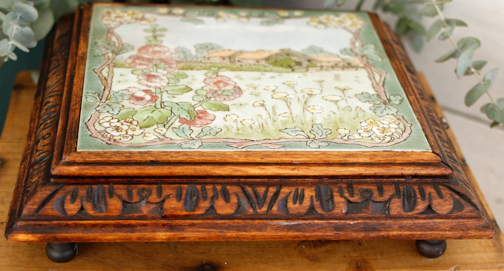 1920s French Antique Ceramic Tile Trivet Hot Plate with Hand-Carved Footed Wooden Base "Trépied Dessous de Plat en Faience" former music box