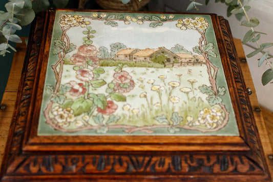 1920s French Antique Ceramic Tile Trivet Hot Plate with Hand-Carved Footed Wooden Base "Trépied Dessous de Plat en Faience" former music box